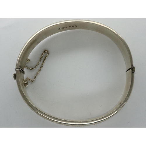 16 - Hallmarked silver snap bangle with safety chain, D: 70 mm, 15g. UK P&P Group 1 (£16+VAT for the firs... 