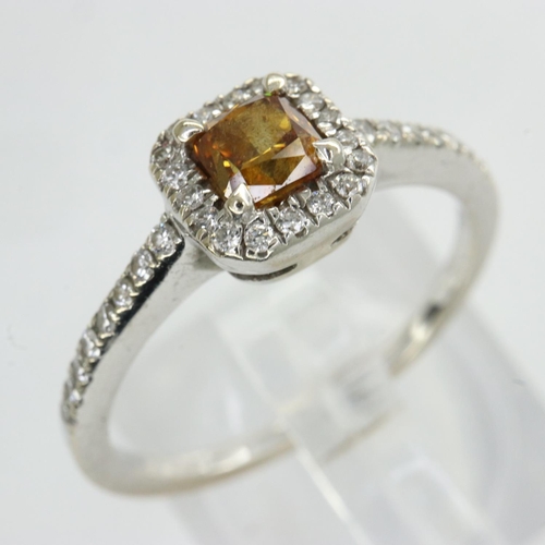 45 - White gold diamond ring set with princess cut yellow diamond and diamond shoulders, size K, 2.2g. UK... 