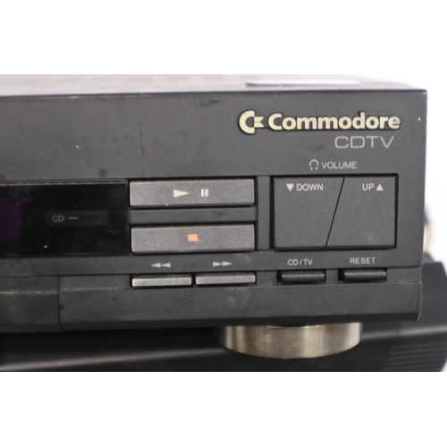 282 - Commodore CDTV computer system, working and boots, with keyboard, mouse, remote and two external dis... 