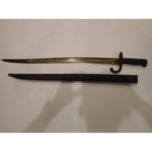 2193 - A French 19th century chassepot sword bayonet with metal scabbard and hooked quillon, dated 1868. UK... 