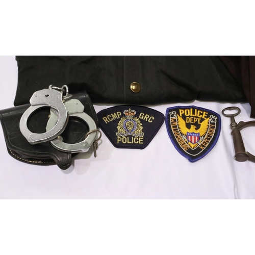 2041 - US Police mixed uniform and equipment, including Oklahoma State shirt, handcuffs and Police & securi... 