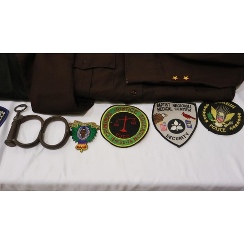 2041 - US Police mixed uniform and equipment, including Oklahoma State shirt, handcuffs and Police & securi... 