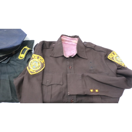 2041 - US Police mixed uniform and equipment, including Oklahoma State shirt, handcuffs and Police & securi... 