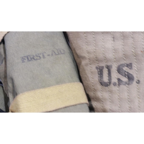 2093 - American post-war canvas webbing and straps, with canteen and ammunition pouches, with a pair of tro... 