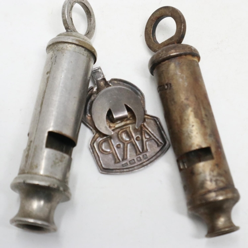 2097 - A British Home Front ARP whistle by Hudson & Co, a hallmarked silver ARP buttonhole and an 1899 date... 