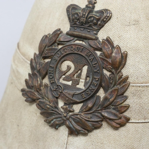 2144 - An early replica pith helmet in the Victorian style, bearing plate for 24th Regiment of foot. UK P&P... 