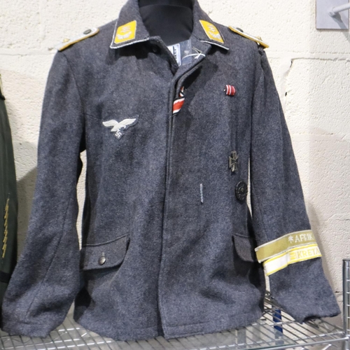 A replica German WWII Luftwaffe officers tunic, displaying ribbon bar ...