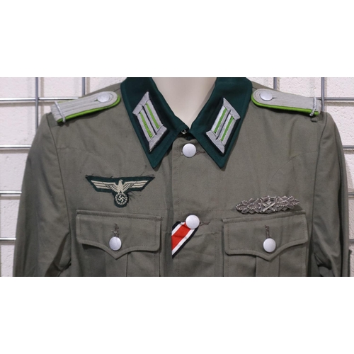 2164 - A German WWII reenactors NCOs tunic, displaying close combat clasp and embroidered breast eagle. UK ... 