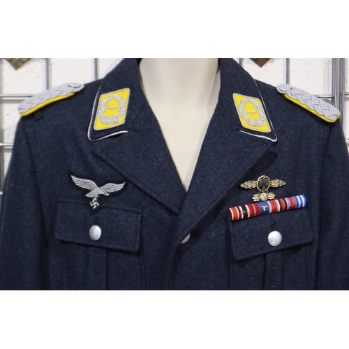 2166 - A German WWII reenactors Luftwaffe officers tunic, displaying ribbon bar, embroidered cuff title, ob... 