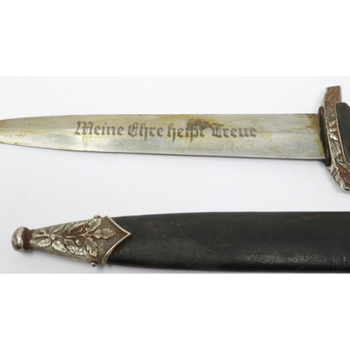 2186 - An aged replica SS presentation dagger with leather bound and metal mounted scabbard, etched blade a... 