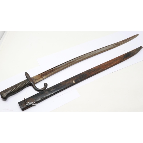 2193 - A French 19th century chassepot sword bayonet with metal scabbard and hooked quillon, dated 1868. UK... 