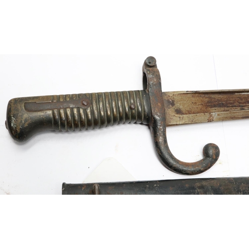 2193 - A French 19th century chassepot sword bayonet with metal scabbard and hooked quillon, dated 1868. UK... 