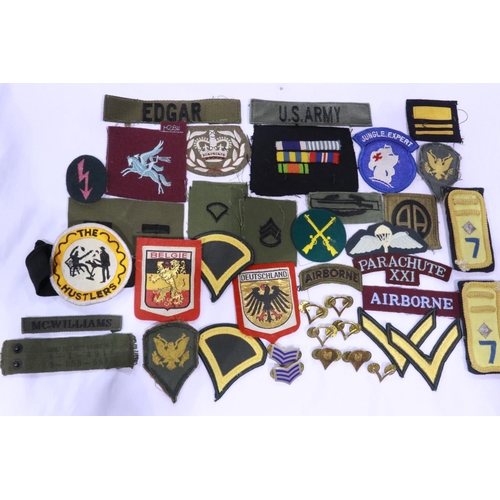 2251 - A large collection of world military embroidered patches, badges and insignia. UK P&P Group 1 (£16+V... 