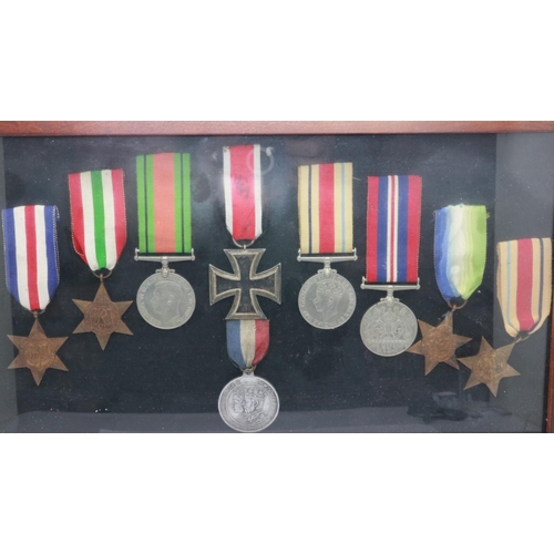 2297 - A group of WWII medals, including five stars and three medals, together with an Iron Cross second cl... 