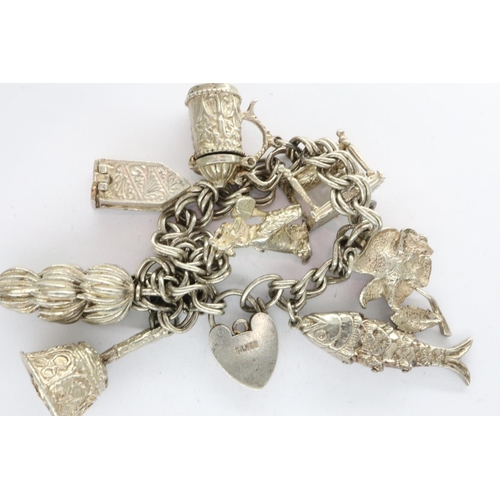 37 - Silver charm bracelet with eight charms and padlock clasp, L: 18 cm. UK P&P Group 1 (£16+VAT for the... 