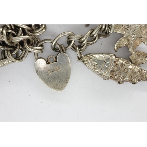 37 - Silver charm bracelet with eight charms and padlock clasp, L: 18 cm. UK P&P Group 1 (£16+VAT for the... 