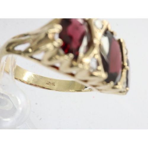 41 - 9ct gold ring set with garnets and topaz, size R, 3.8g. UK P&P Group 0 (£6+VAT for the first lot and... 