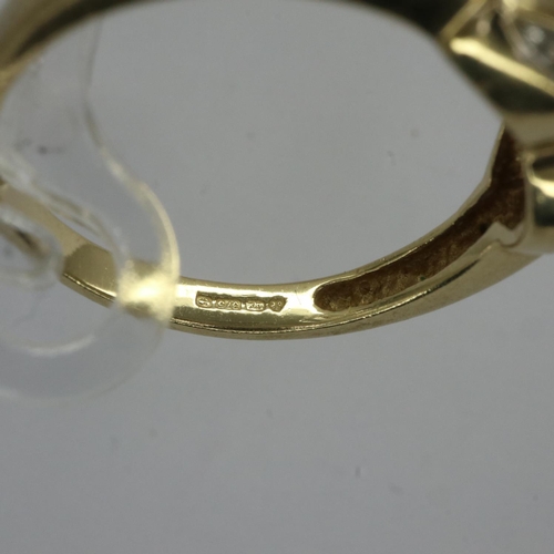 53 - 9ct gold crossover ring set with diamonds, size N, 2.3g. UK P&P Group 0 (£6+VAT for the first lot an... 