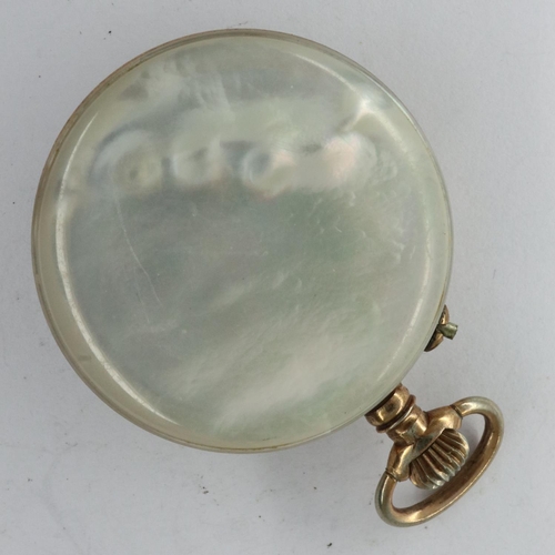 104 - Mother of pearl and yellow metal cased ladies fob watch, working at lotting. UK P&P Group 1 (£16+VAT... 