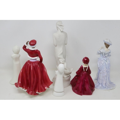 329 - Three Royal Doulton figurines, Discovery HN3428, Helena Lady of the Year 2009, and Carol Singer Boy ... 