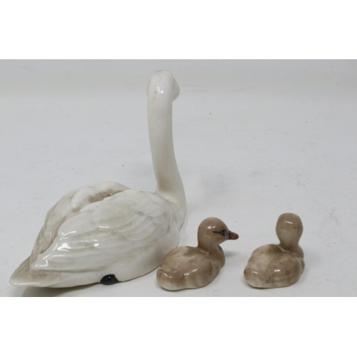 362 - Beswick swan and two cygnets, no cracks or chips, largest L: 11 cm. UK P&P Group 1 (£16+VAT for the ... 