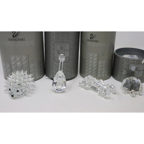 430 - Four Swarovski miniatures, hedgehog, car, lute and a turtle, all boxed. UK P&P Group 2 (£20+VAT for ... 