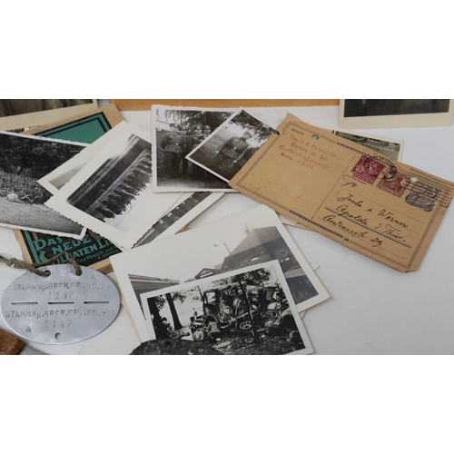 2077 - Mixed German WWII period ephemera and miscellany, including photographs, Luftwaffe flight record boo... 