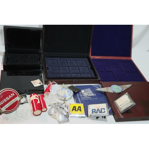 2083 - A quantity of coin collectors boxes, with a selection of automotive badges including AA. Not availab... 