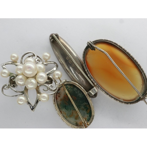 14 - Four silver brooches including a hallmarked silver example, largest L: 39 mm. UK P&P Group 1 (£16+VA... 