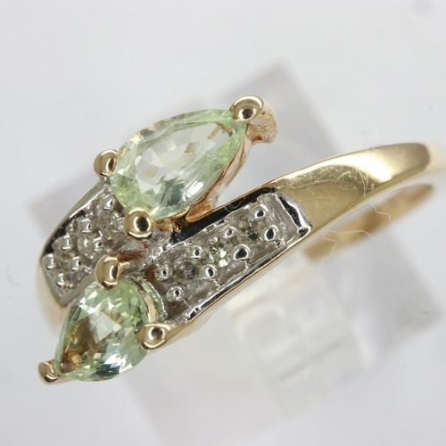 18 - 9ct gold ring set with peridot and diamonds, size M, 1.9g. UK P&P Group 0 (£6+VAT for the first lot ... 