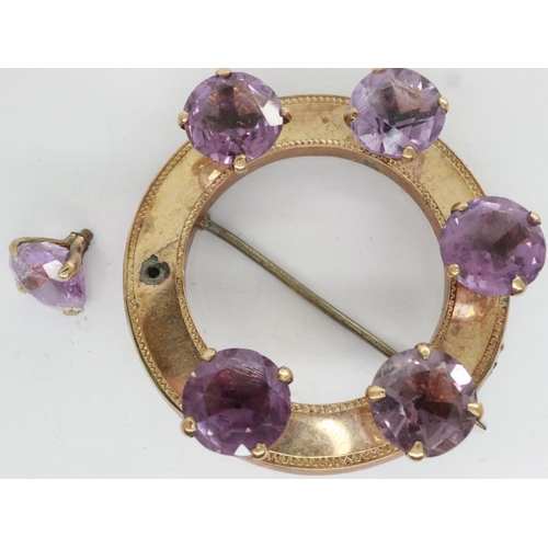 7 - Unmarked gold brooch set with with six large amethysts, one amethyst loose but present, also lacking... 