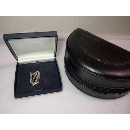 1063 - Hallmarked silver Irish harp brooch and a travelling jewellery box. P&P Group 1 (£16+VAT for the fir... 