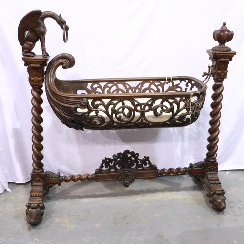 532 - Substantial Victorian gothic bassinet (possibly Black Forest), the boat-form piecework cot suspended... 