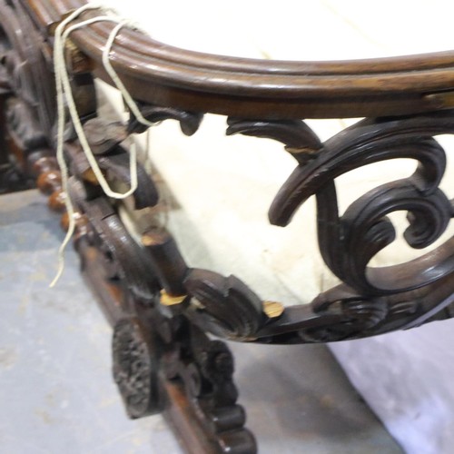 532 - Substantial Victorian gothic bassinet (possibly Black Forest), the boat-form piecework cot suspended... 