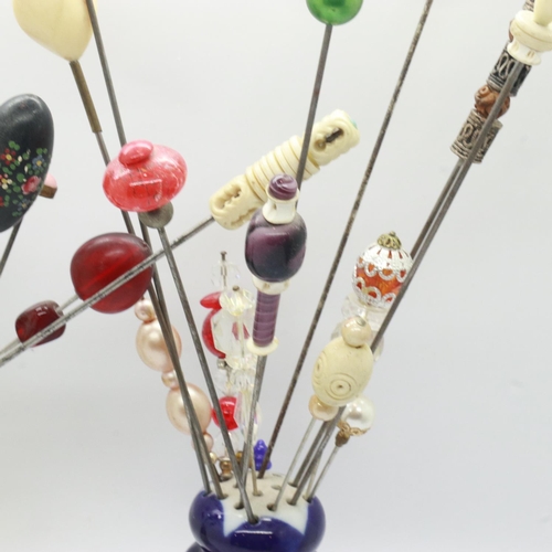 145 - Quantity of vintage hatpins in two hatpin holders. UK P&P Group 2 (£20+VAT for the first lot and £4+... 