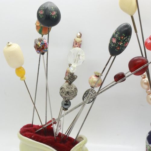 145 - Quantity of vintage hatpins in two hatpin holders. UK P&P Group 2 (£20+VAT for the first lot and £4+... 