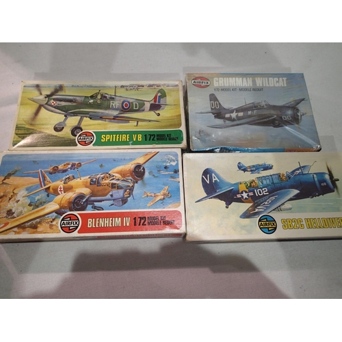 2292 - Four 1/72 scale Airfix WWII aircrafts; Wildcat, Spitfire VB, Helldiver, Blenheim IV, all appear comp... 