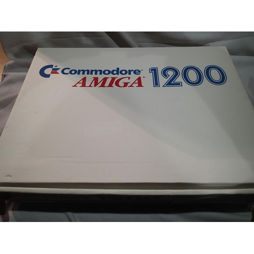 2364 - Commodore Amiga 1200 console, transformer, leads, mouse etc, in excellent condition, box with 19/12/... 