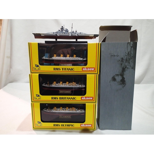 2415 - Three Gilbow model ships on display stands, 1/1750 scale, Titanic, Britannic, and Olympic, plus Atla... 