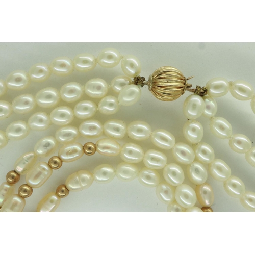 34 - Triple strand choker of pearls, with a 9ct gold clasp and gold spacers, L: 40 cm. UK P&P Group 0 (£6... 