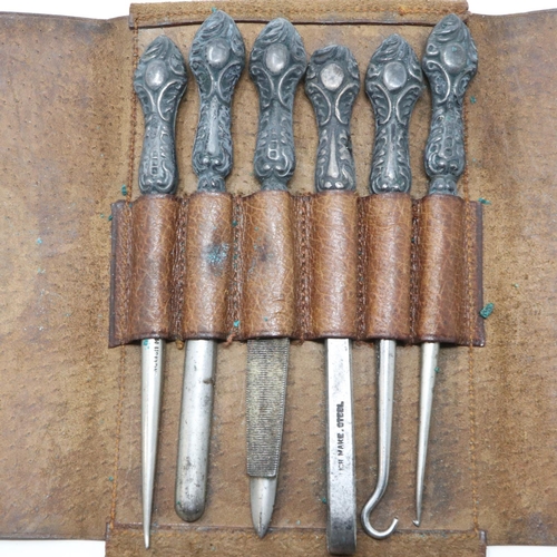 94 - Hallmarked silver handled manicure set in a leather case, Birmingham assay. UK P&P Group 1 (£16+VAT ... 