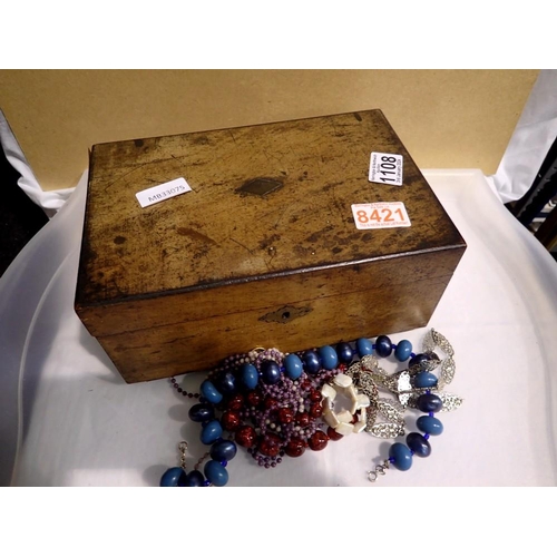 1108 - Walnut box containing costume jewellery. Not available for in-house P&P