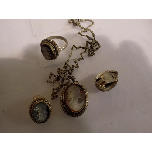 1111 - A suite of continental silver jewellery, each set with a carved abalone cameo, comprising pendant ne... 