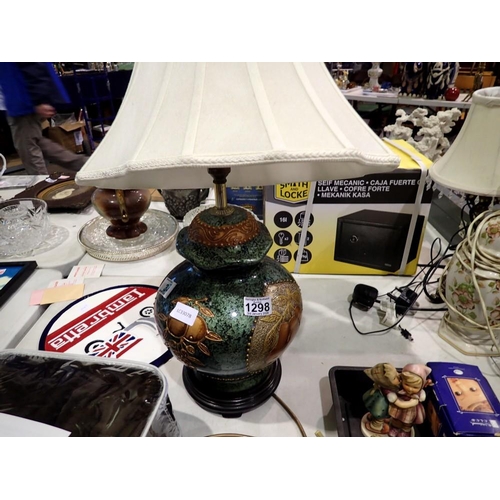 1298 - Large ceramic fruit patterned lamp with fabric shade. All electrical items in this lot have been PAT... 