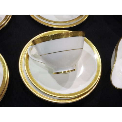 270 - Royal Doulton tea and dinnerware in the Royal Gold pattern of twenty six pieces, H4980, no cracks or... 