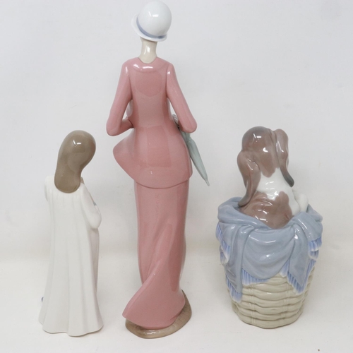 238 - Two Nao figurines and a Lladro dog in basket, no cracks or chips, largest H: 31 cm. UK P&P Group 3 (... 