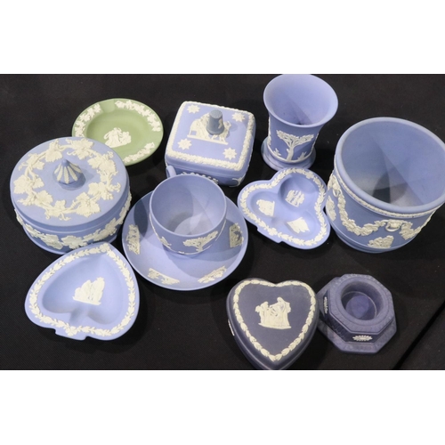 302 - Collection of Wedgwood Jasperware ceramics, mostly in powder blue, including covered boxes, small pl... 