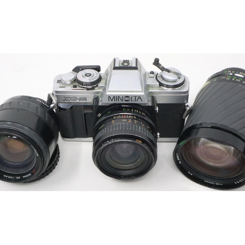 428 - Minolta XGM camera and mixed lenses. Not available for in-house P&P