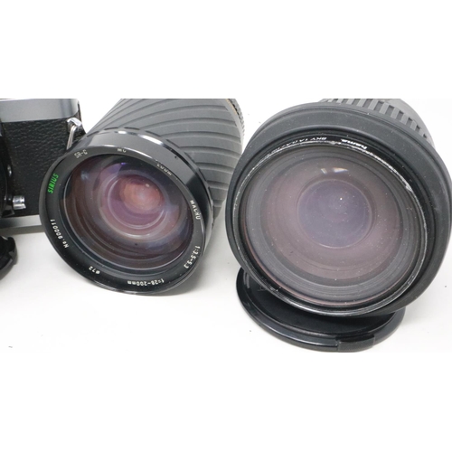 428 - Minolta XGM camera and mixed lenses. Not available for in-house P&P