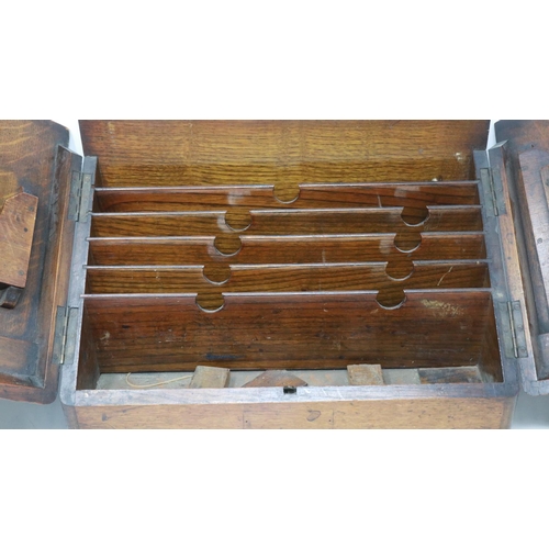 359 - Fitted oak letter rack, damage to front, lacking handles, L: 79 cm (open). Not available for in-hous... 